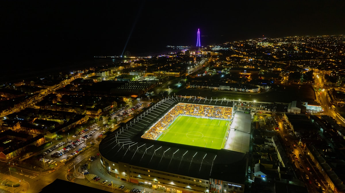 Aerial view of soccer stadium lit up at night — World Cup 2026 round of 32 knockout stage