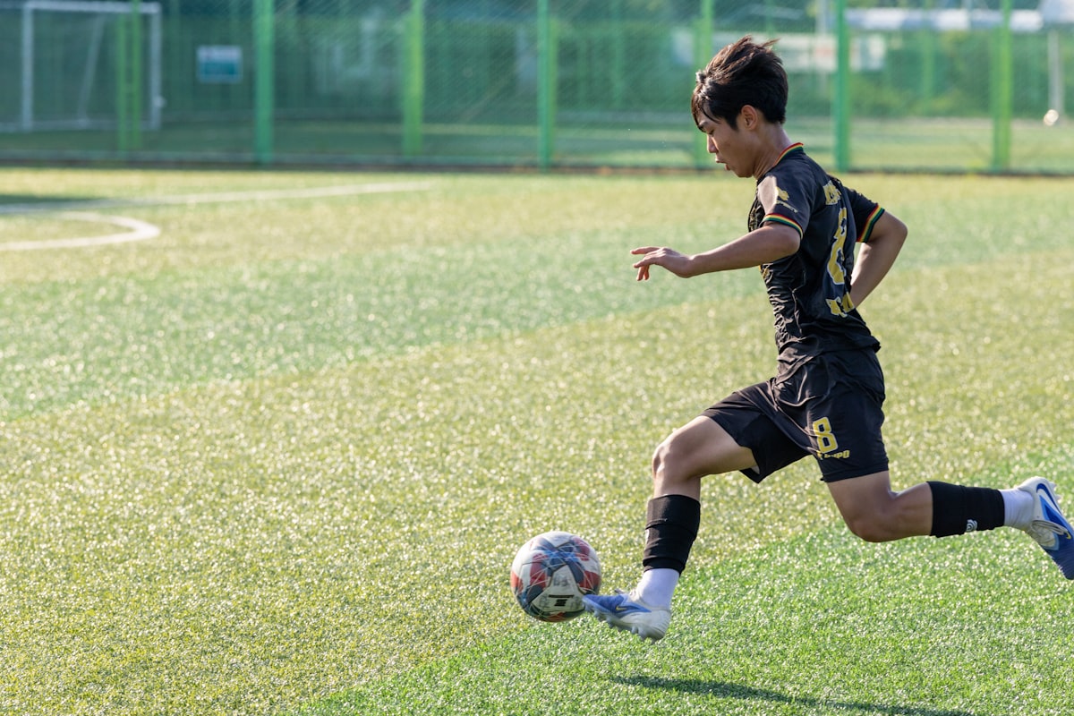 Young player striking a soccer ball — the rising stars of World Cup 2026